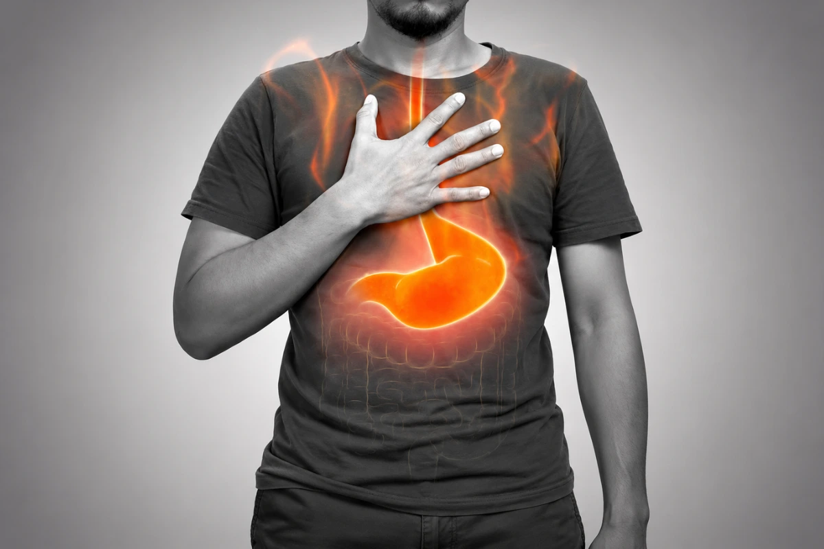 Person experiencing burning discomfort from acid reflux and heartburn